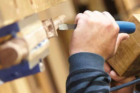 A man carving in a workshop for a course with Te Wananga o Aotearoa